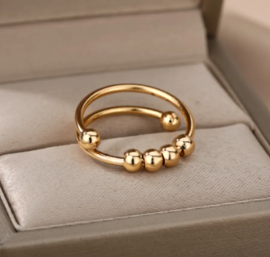 Anillo Dorado Anti-Ansiedad Bolitas Gira